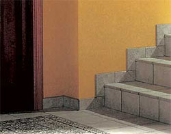 Если во всем доме вдоль стен уложены керамические плинтусы, логично оформить ими и ступени лестницы